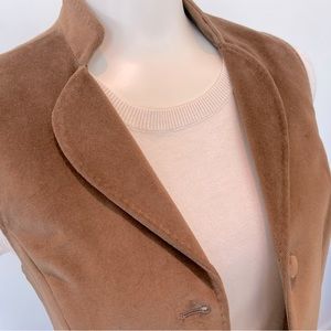 Purchased in London, U.K. at an elegant suit and tweed shop. Women’s velvet vest